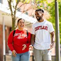 Students walking together dressed in Cortland gear